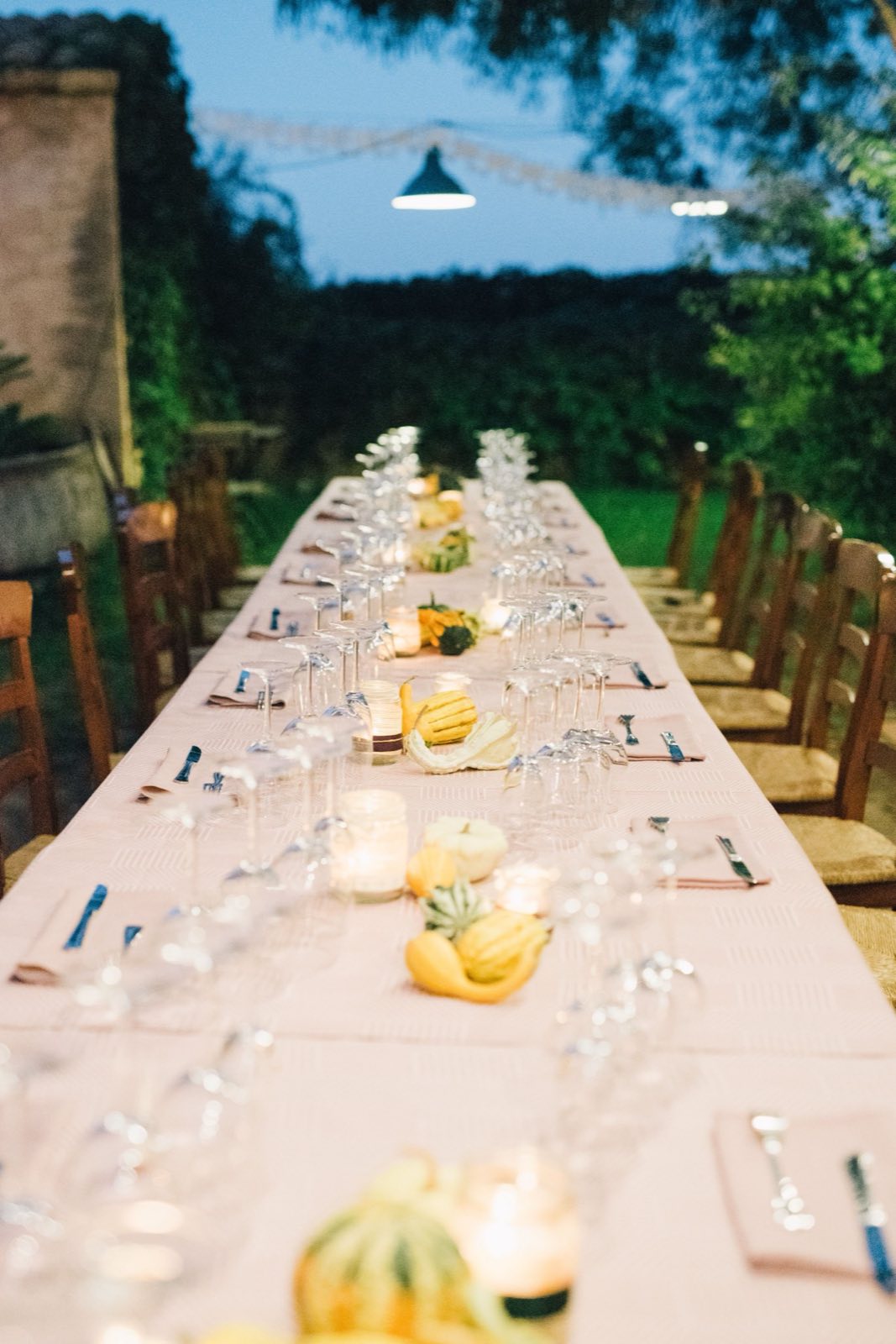 Atmospheric outdoor dinner table used as concept imagery